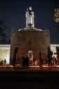 People light candles, at The Brothers` Cemetery in Riga.